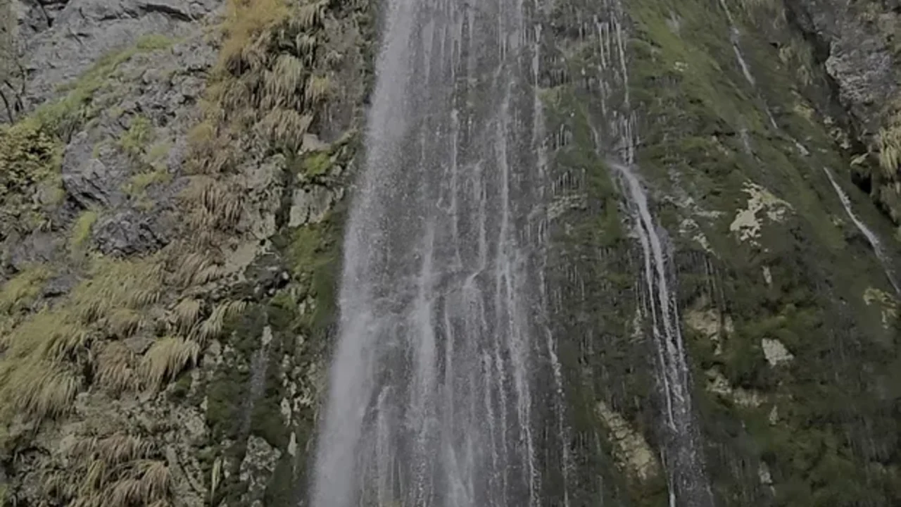 Grunas Waterfall flowing in the Theth valley in summer